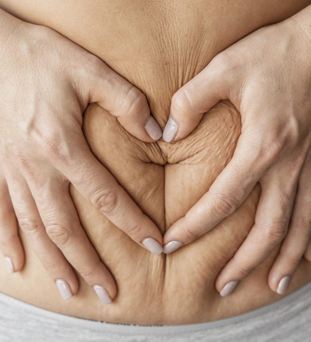 close-up-hands-holding-belly